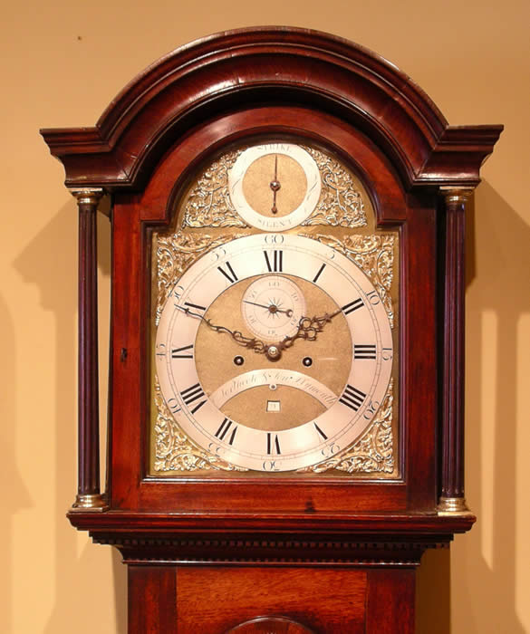 clock photo , Longcase clock by Northcote and son Plymouth , Full Brass dial with Strike silent in an Arched Mahogany case