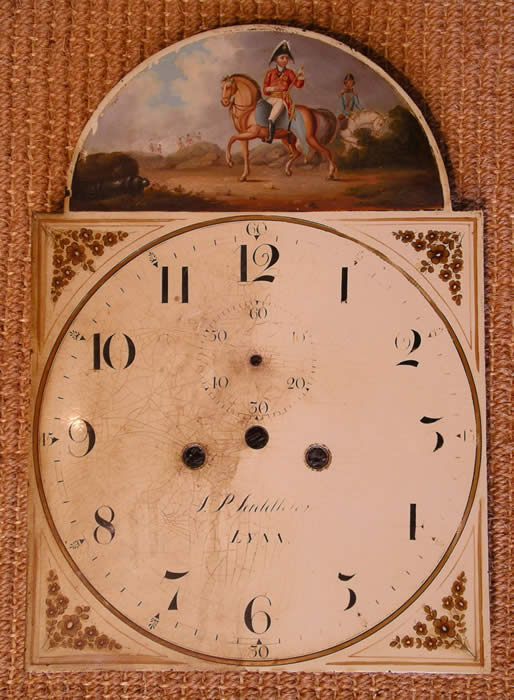 Showing the dial half way through cleaning , restoration .