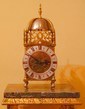A decorative French Lantern clock made in Paris circa 1890