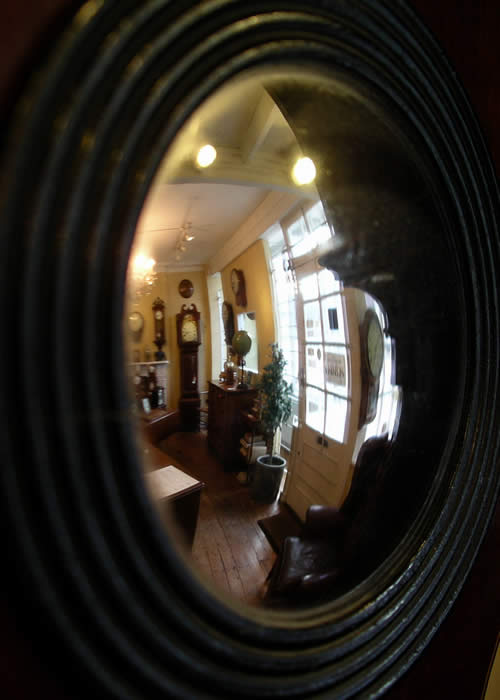 An ebony and boxwood strung , mahogany wheel Barometer with an 10" engraved and silvered dial with brass bezel and covered with a convex glass, a silvered Thermometer scale with red alcohol tube. The convex 'Butlers' mirror with ebonised reeded bezel .Below the barometer dial is the ivory knob for positioning the brass hand (Yesterdays reading) and at the bottom is a spirit level engraved with Warranted Correct . Circa 1870 