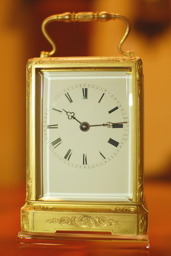 Carriage clock , one piece case hand engraved 