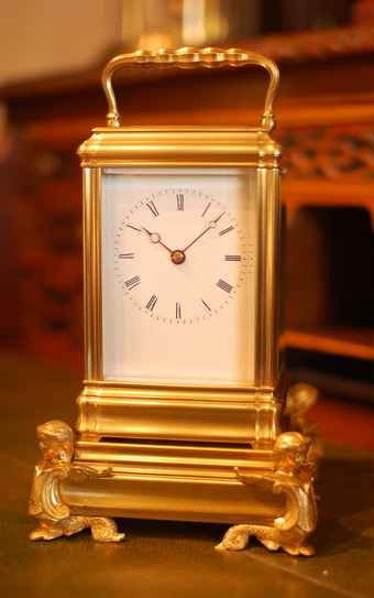 Carriage clock Bell Strike by E and E Emanuel on original stand , fine and rare . 