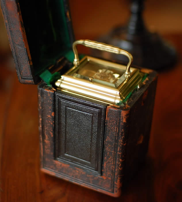Carriage clock in its leather covered case