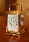 Henri Jacot Carriage clock in a Gilded Gorge Case with original Leather travelling case