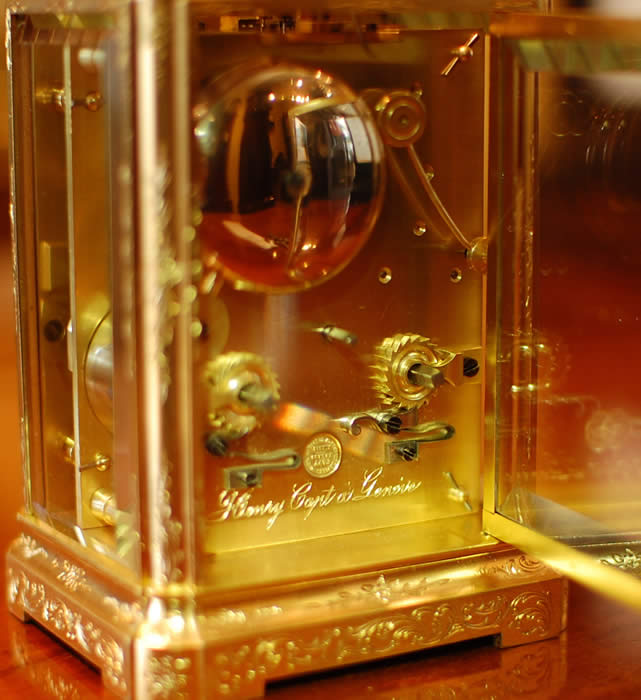 A good early carriage clock by Henry Capt of Geneve who was working circa 1840 . This is a superb example with the original , early lever platform . The clock is engraved on the back plate with the name in script along the base . The large top bevelled glass below the very ornate handle shows the escapement . A fine 8 day movement - bell striking . The case is 'one piece' design with superb hand engraving and gilding of good colour , all bevelled white glass polished inside and out . The dial showing Roman numerals and the makers name below the six with the original 'Trefoil' hands . Please view the large images by clicking through the photos . 12 month RTB Guarantee
