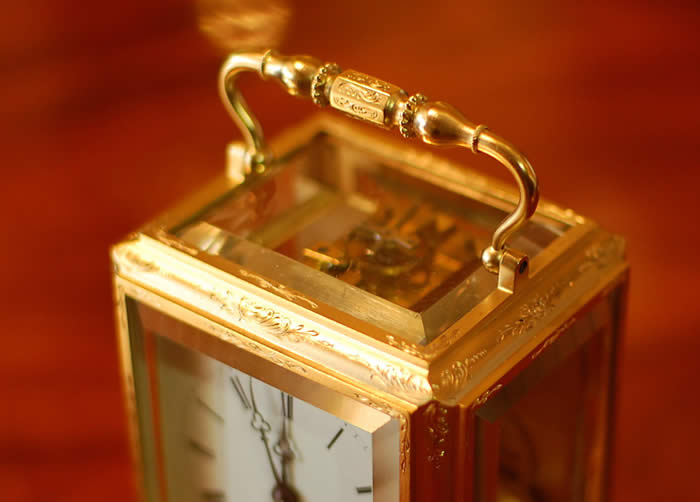 A good early carriage clock by Henry Capt of Geneve who was working circa 1840 . This is a superb example with the original , early lever platform . The clock is engraved on the back plate with the name in script along the base . The large top bevelled glass below the very ornate handle shows the escapement . A fine 8 day movement - bell striking . The case is 'one piece' design with superb hand engraving and gilding of good colour , all bevelled white glass polished inside and out . The dial showing Roman numerals and the makers name below the six with the original 'Trefoil' hands . Please view the large images by clicking through the photos . 12 month RTB Guarantee