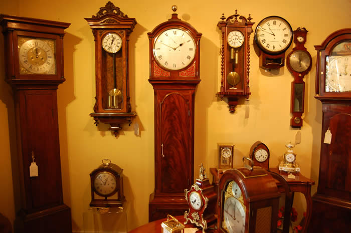 This is a beautiful longcase clock , we do not normally describe our clocks so passionately but this is an object of beauty . The overall proportions of the clock are perfect , the balance of the silvered dial and polished quarter sound frets , the simple yet elegant hands , the mellowed mahogany case , the tuned bell strike for the hours sounding through silk backed 'fishscale' frets . The movement is deadbeat with mainainting power ,8 day of extremely high quality throughout with very substantial plates . The design is classic regency with the unfussy round dial , hand engraved with the makers names Gravell and Tolkien London and numbered . Tolkien is the great Grandfather of the author J.R.R. Tolkien (The Hobbit , Lord of the rings ) Gravell and Tolkien were the successors to the late Eardley Norton . 