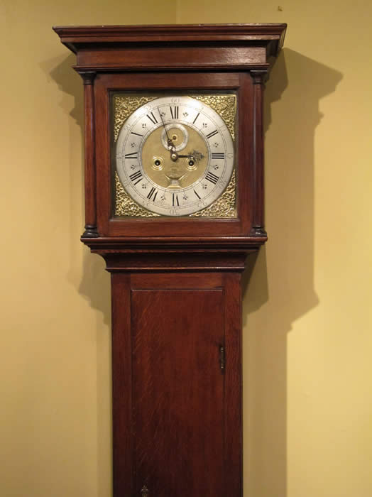 A slim solid oak Longcase clock by J.Green of Althorpe ( the resting place of Princess Diana ) circa 1720 . The full brass dial showing silvered Chapter ring with fleur de lys between the Roman numerals and quarter hour markers within , seconds and date aperture decorated with and engraved Basket of Plenty and ringed winding holes with a matted centre and Blued steel hands . The case is of good proportions being only 82 inches tall . The trunk door long and narrow with a brass Key escution . James Green is listed working from 1712 to 1736 in the book - G.H.Bailles - Watch and Clockmakers of the world . 