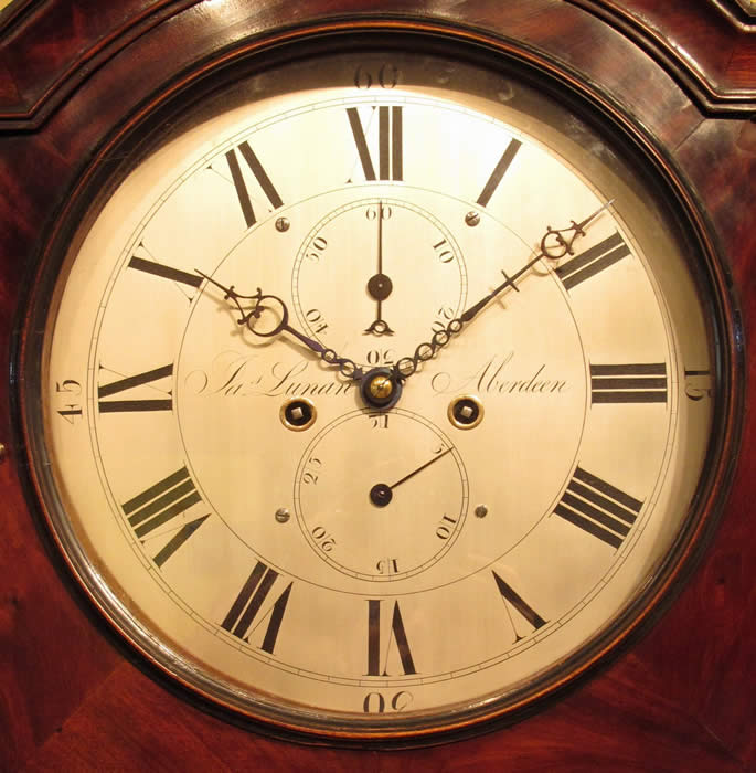 A fine flame mahogany Scottish longcase clock of 8 day duration, 'Broken arch' shape hood with Boxwood detailing either side of the dial 12