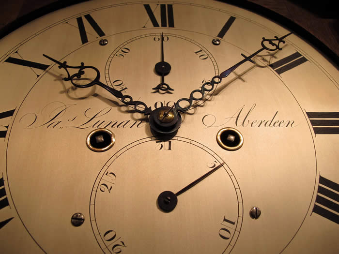 A fine flame mahogany Scottish longcase clock of 8 day duration, 'Broken arch' shape hood with Boxwood detailing either side of the dial 12