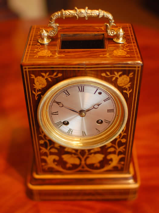 A very fine marquetry inlaid rosewood mantel clock of superb proportions, very good colour and patina with small lenticel below the decorative handle to view the original and highly unusual 'single Chaff cutter' escapement , The 3