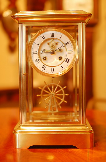 Please click on this image to see more detailed photographs of this clock. A rare French four glass or 'crystal regulator' , striking the hours and the half hours on a Bell. A perfect two section white enamel dial with Roman numerals and with the center of the dial showing the jewelled 'deadbeat' escapement . Bevelled glass to all sides with the regulator being a Ship's wheel on display instead of a pendulum . These clocks are extremely rare and this is the first we have had in 20 years ! A fine French 8 day movement and polished blue steel Breguet Hands. The movement is stamped by S.Marti et Cie , Bronze medal winner and working from 1863 to 1890 , this fine clock would have been made circa 1880 , standing 33cms Tall . 