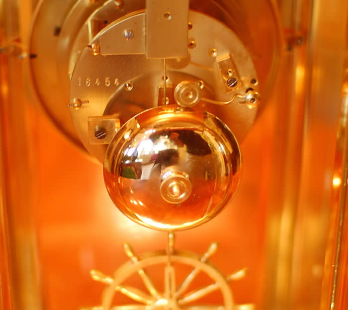 Movement photo of French four glass with Ships wheel regulation , a fine example . 