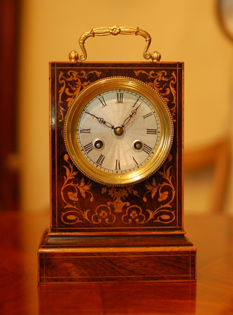 Paul Garnier Paris Mantel clock in rosewood with inlays .  