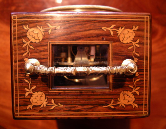 A very fine marquetry inlaid rosewood mantel clock of superb proportions, very good colour and patina with small lenticel below the decorative handle to view the original and highly unusual 'single Chaff cutter' escapement , The 3