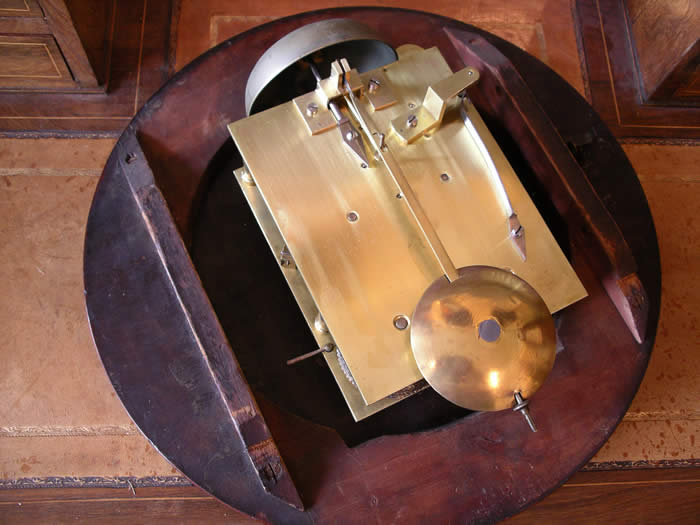 A rare 12" British double fusee wall clock in a mellow , mahogany case. The movement is very substantial with a five pillar ,Chain fusee and square plates