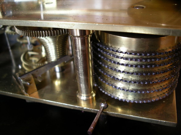 A rare 12" British double fusee wall clock in a mellow , mahogany case. The movement is very substantial with a five pillar ,Chain fusee and square plates