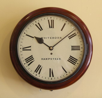 A 14 inch dial , British fusee wall clock in a mellow , mahogany case. The movement is single fusee has square plates with fine original Steel Hands and runs for 8 days . The enamelled dial is signed Whitehorn of Hampstead , who is recorded working from 1863 , this clock would date to around 1880-90 .The case has two doors - the side door held with a latch the convex bottom door held with a lock and Key.